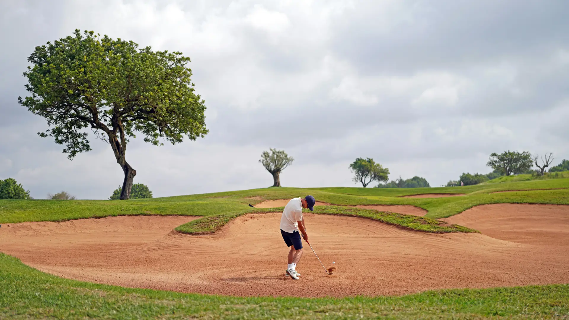 Golfer playing from a bunker