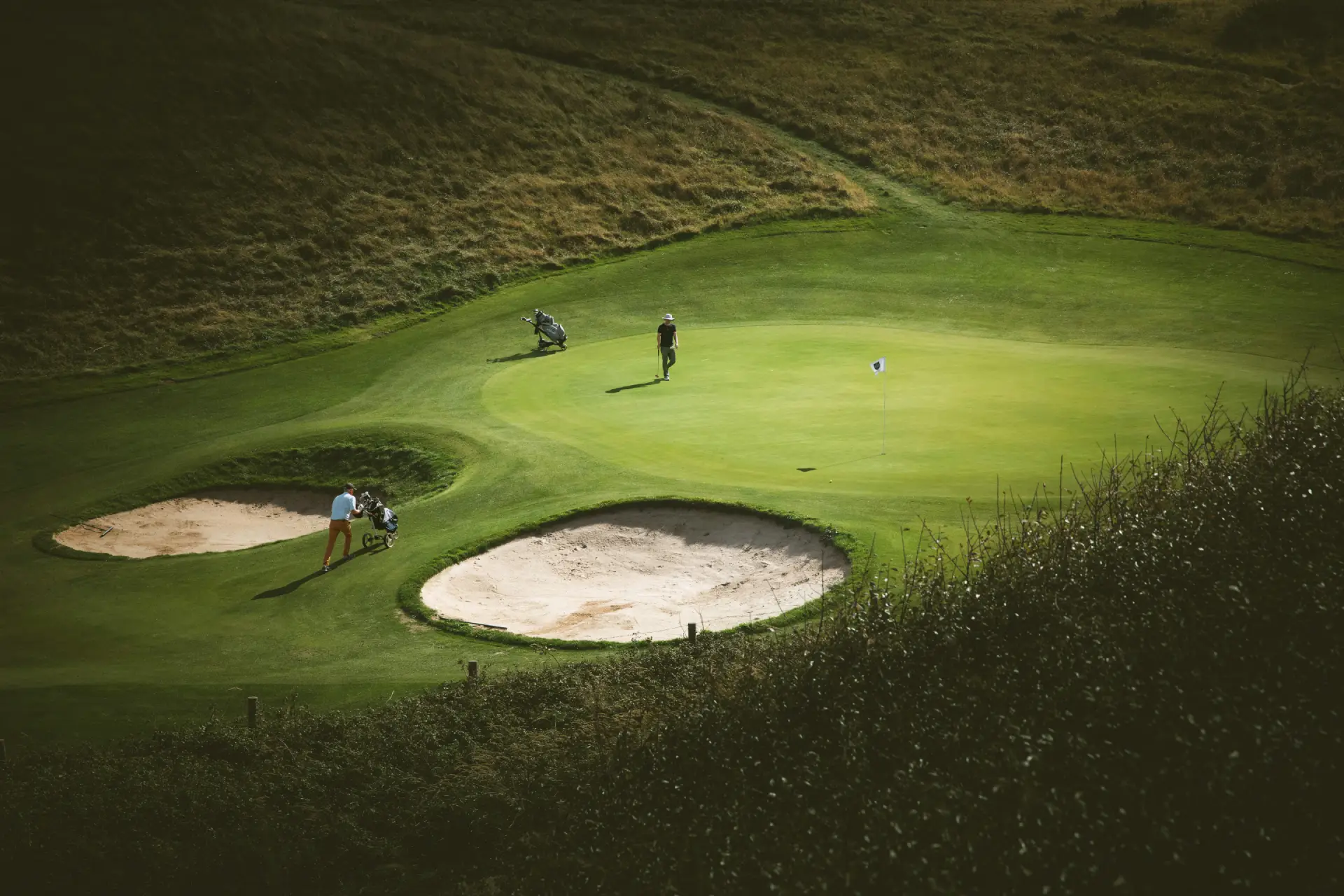 Golfers walking together on the course